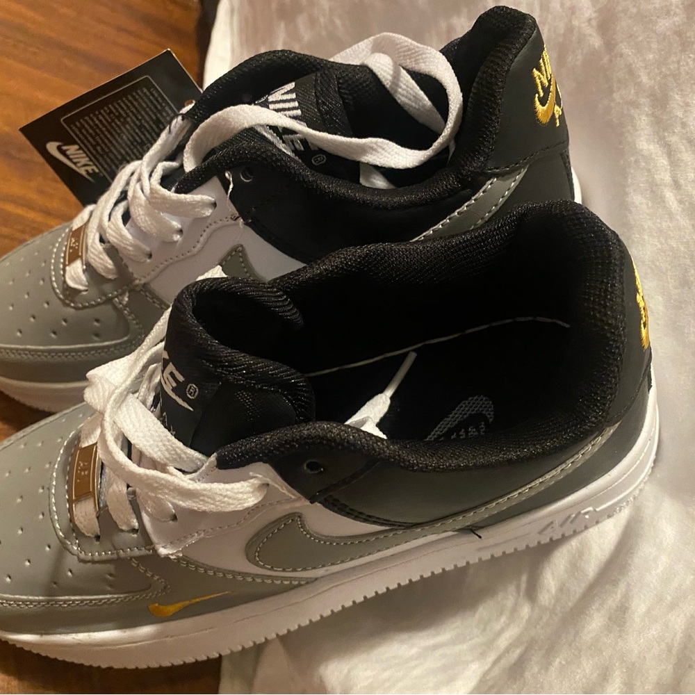 Nike Low-Top Sneakers in White, Black, Gray & Gold